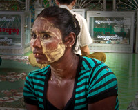 Woman with thanaka cosmetic face paint-Sule Pagoda-Yangon
